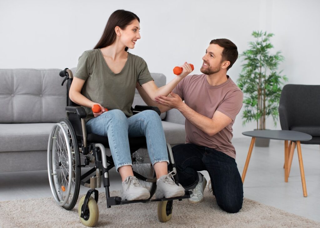 A man in a wheel chair being pushed by a woman