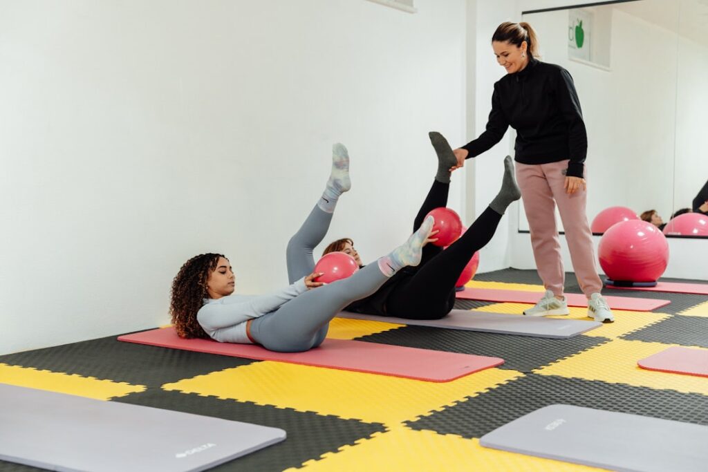a group of people doing exercises in a gym