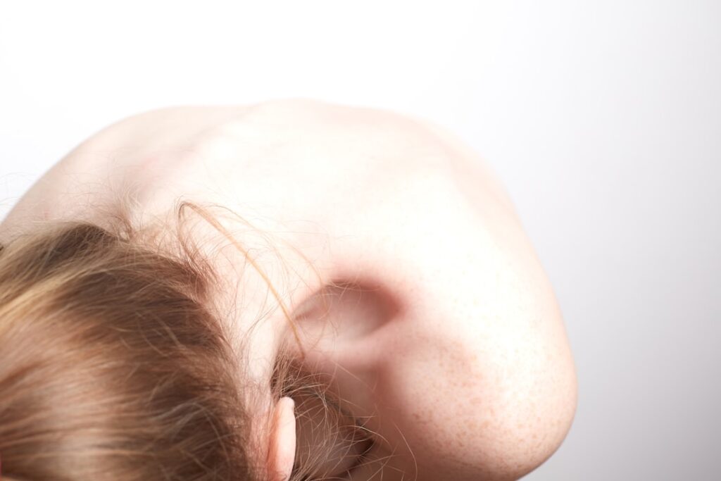 persons head on white wall